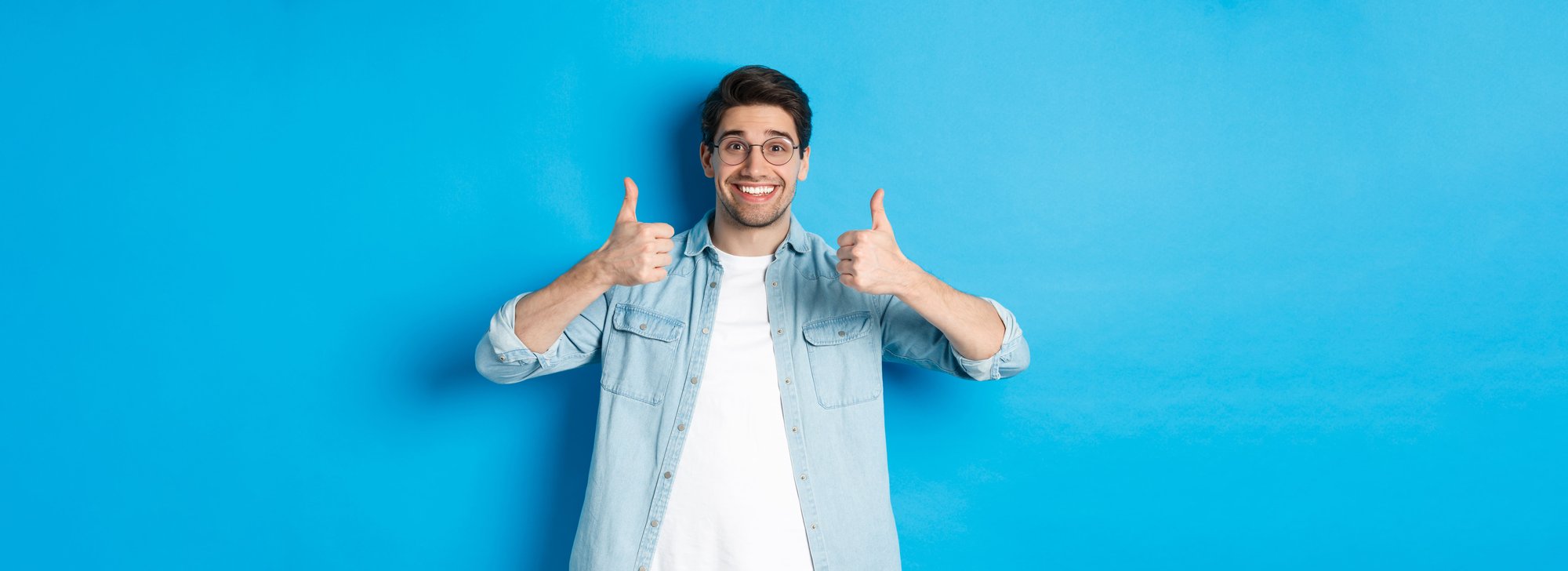 attractive-young-man-wearing-glasses-casual-clothes-showing-thumbs-up-approval-like-something (1)